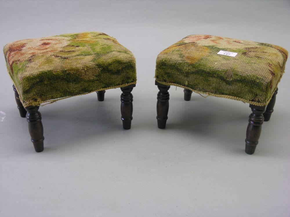 Appraisal: A pair of Victorian footstools on turned legs upholstery worn