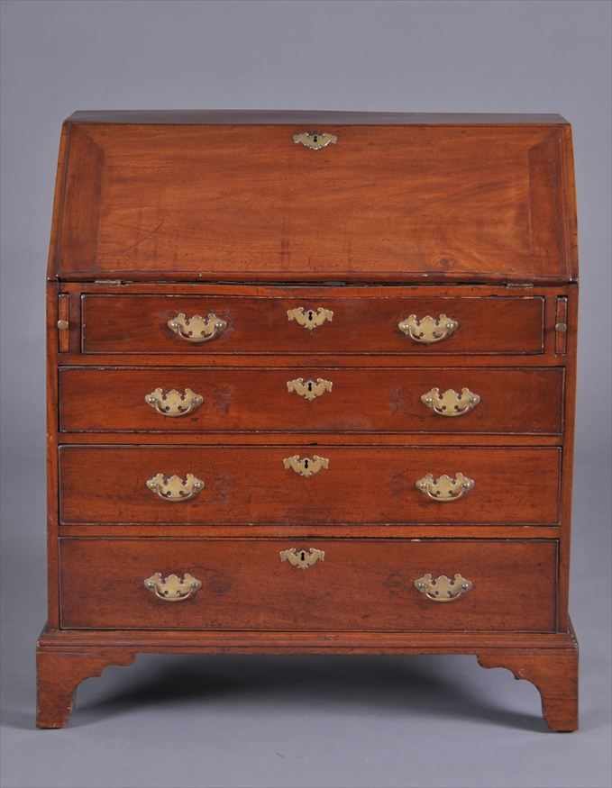 Appraisal: GEORGE III MAHOGANY SLANT-FRONT DESK The flap opening to drawers