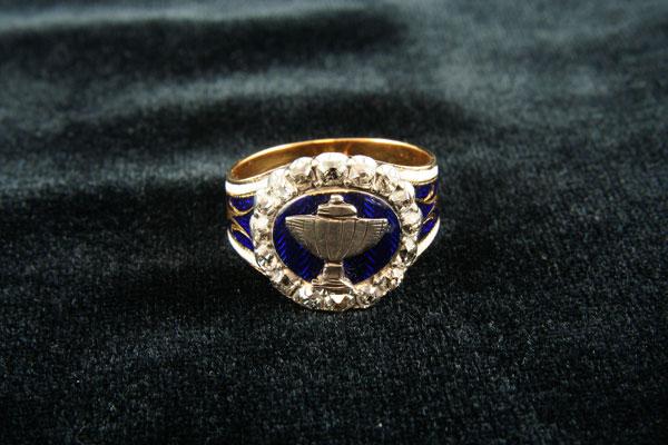 Appraisal: A Diamond and Enamel Ring the embossed urn motif on