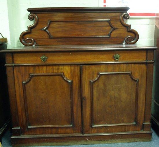 Appraisal: A late Victorian mahogany chiffonier the scrolling panel back above