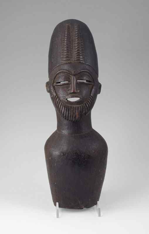 Appraisal: KURUMBA CARVED FIGURE WITH ANTELOPE HORNS Hollow carved figure of