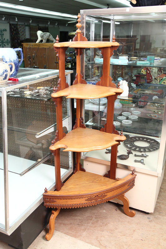 Appraisal: WHAT-NOT-SHELF Four tiered oak and walnut shelf with turned finial