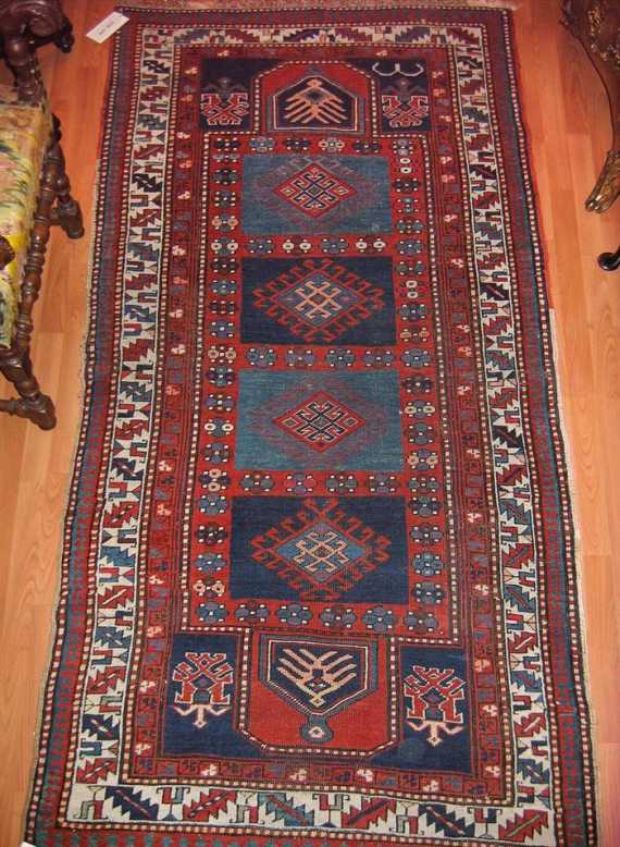 Appraisal: KAZAK alt Red central field with four blue medallions the