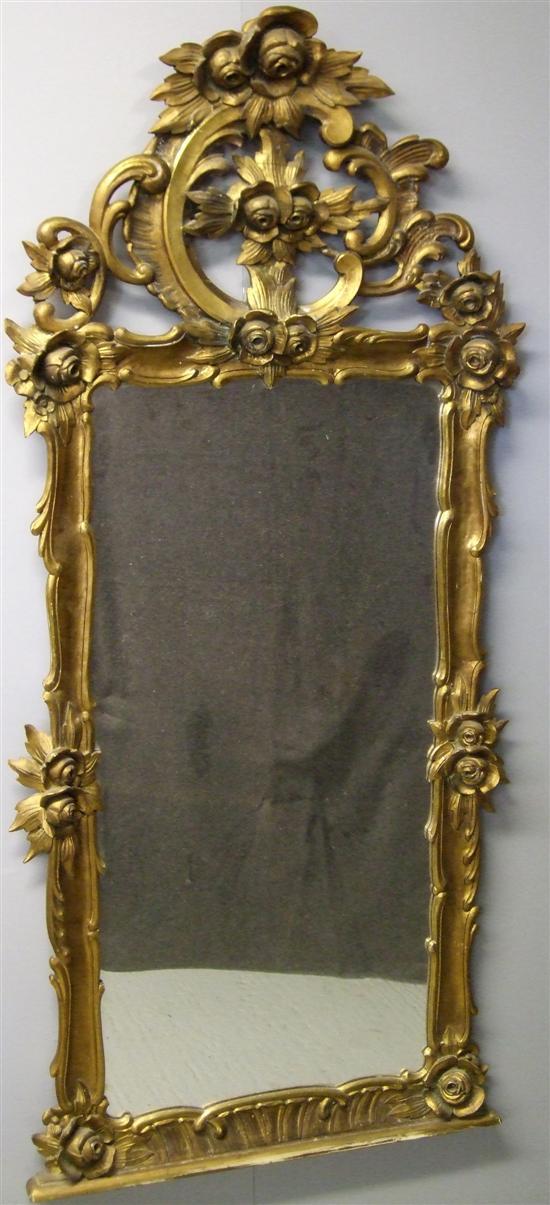 Appraisal: th century carved giltwood wall mirror in rococo style decorated