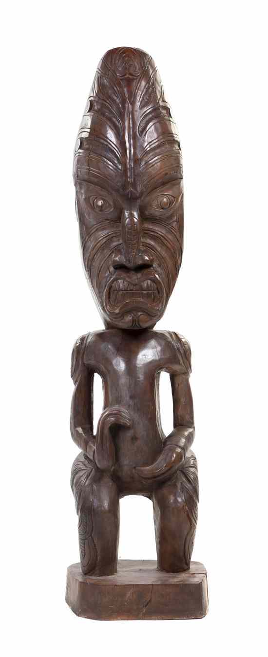 Appraisal: A Carved Wood Tiki depicted in a crouching position having