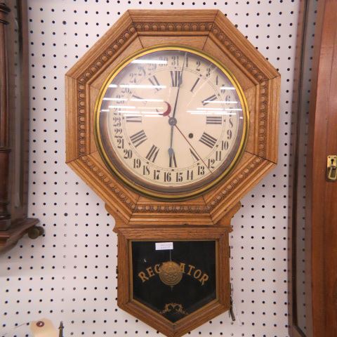 Appraisal: Oak Regulator Wall Clock calendar model schoolhouse style carved octagonal