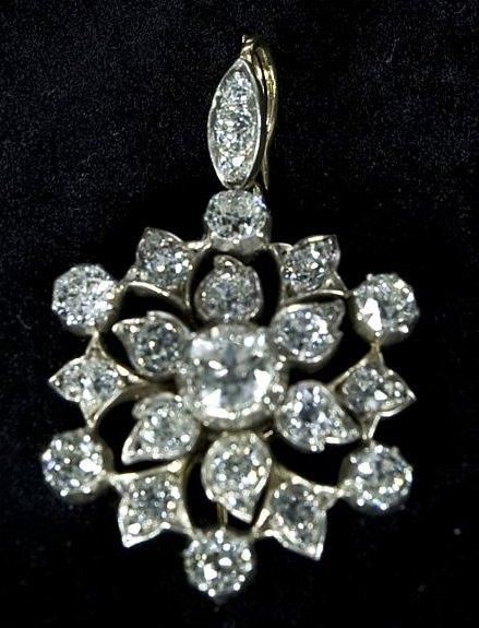 Appraisal: A diamond set pendant of pierced circular form on a