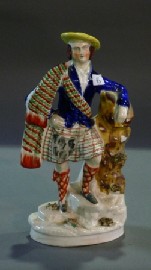 Appraisal: A Staffordshire figure of a Highland man cmh