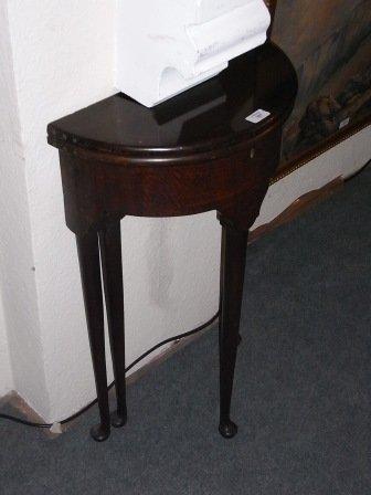 Appraisal: A SMALL MAHOGANY DEMI-LUNE FOLD OVER TEA TABLE on tapering