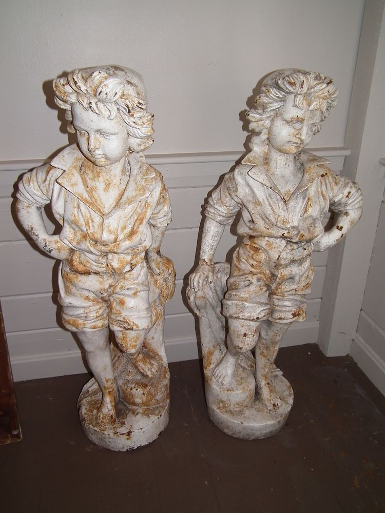 Appraisal: ANTIQUE IRON GARDEN STATUES Pair of large very heavy iron