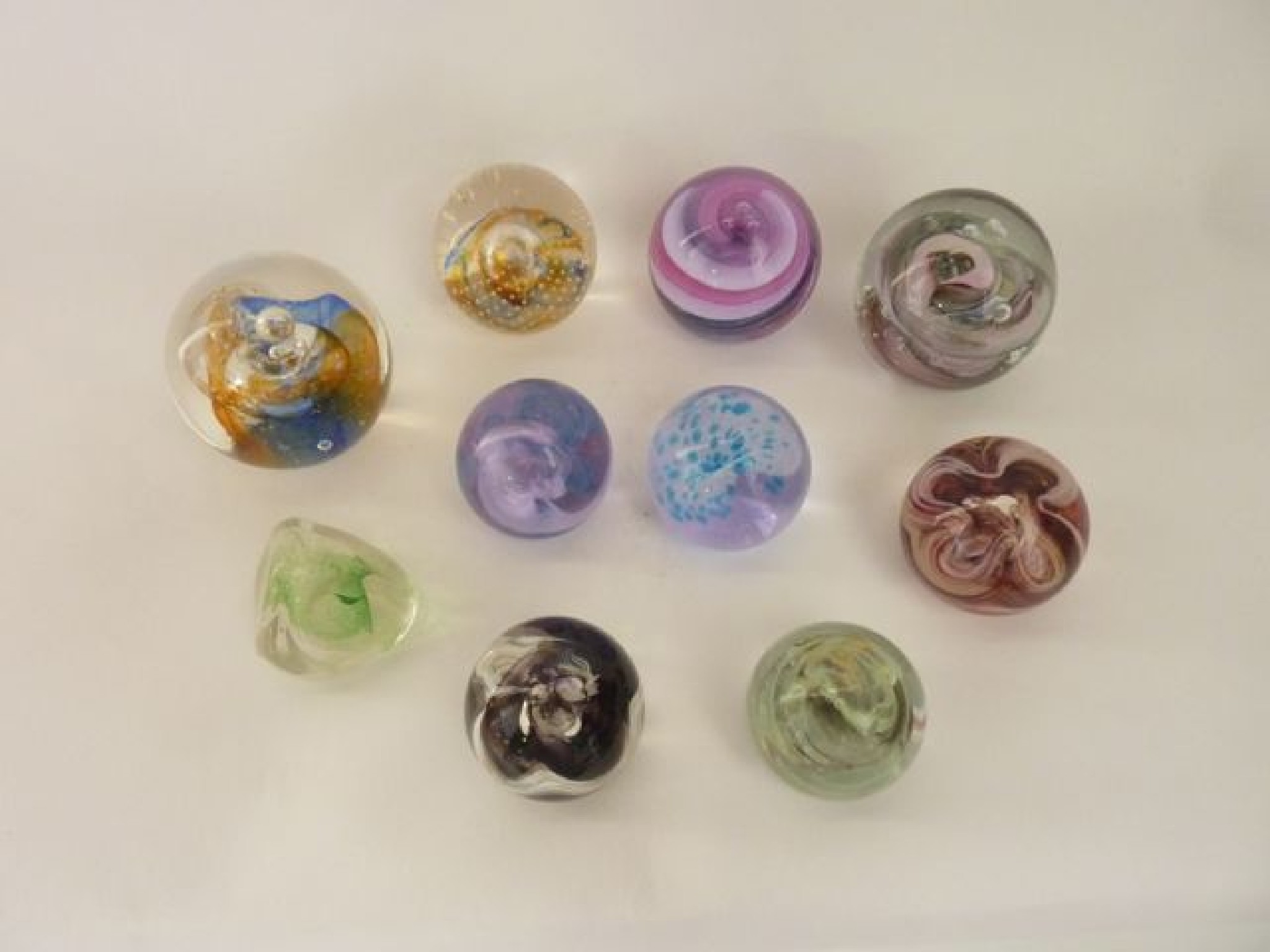 Appraisal: A selection of ten glass decorative glass paperweights to include