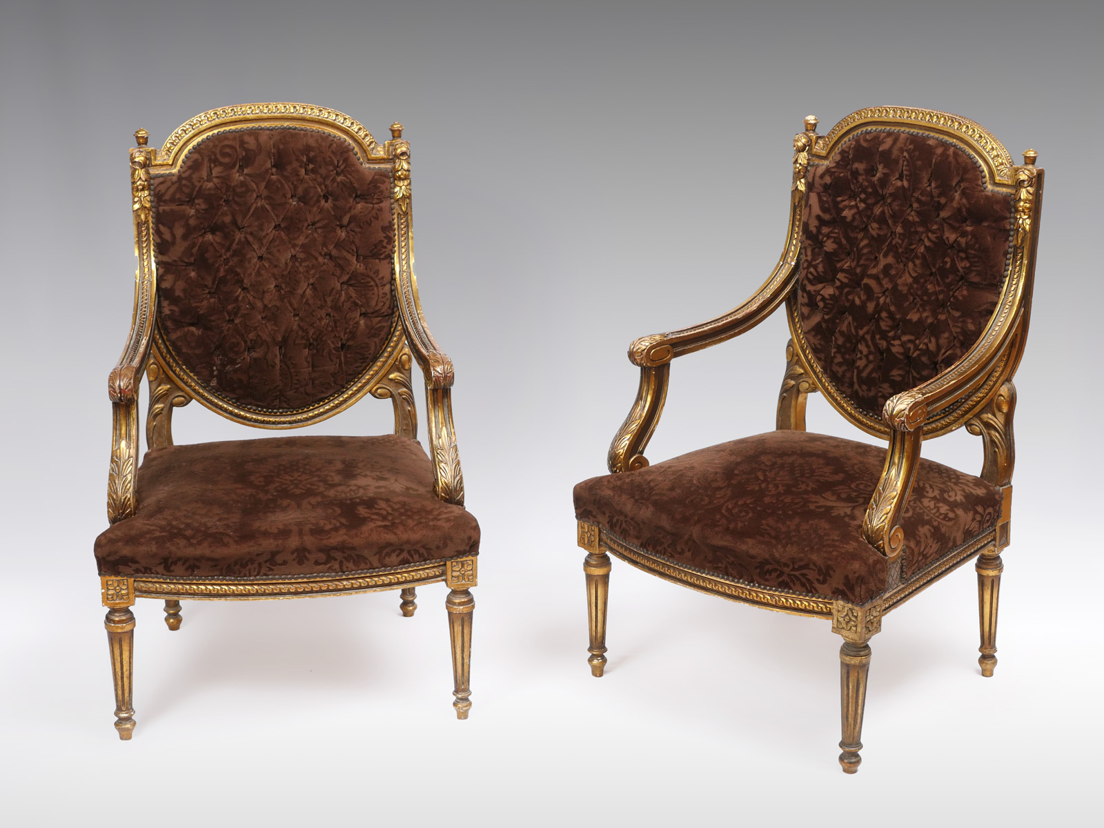 Appraisal: PAIR OF CARVED FIREPLACE CHAIRS having an overall Gilt incised