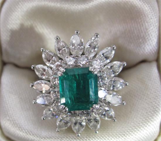 Appraisal: Emerald and Diamond Dinner Ring Cushion cut emerald surrounded by