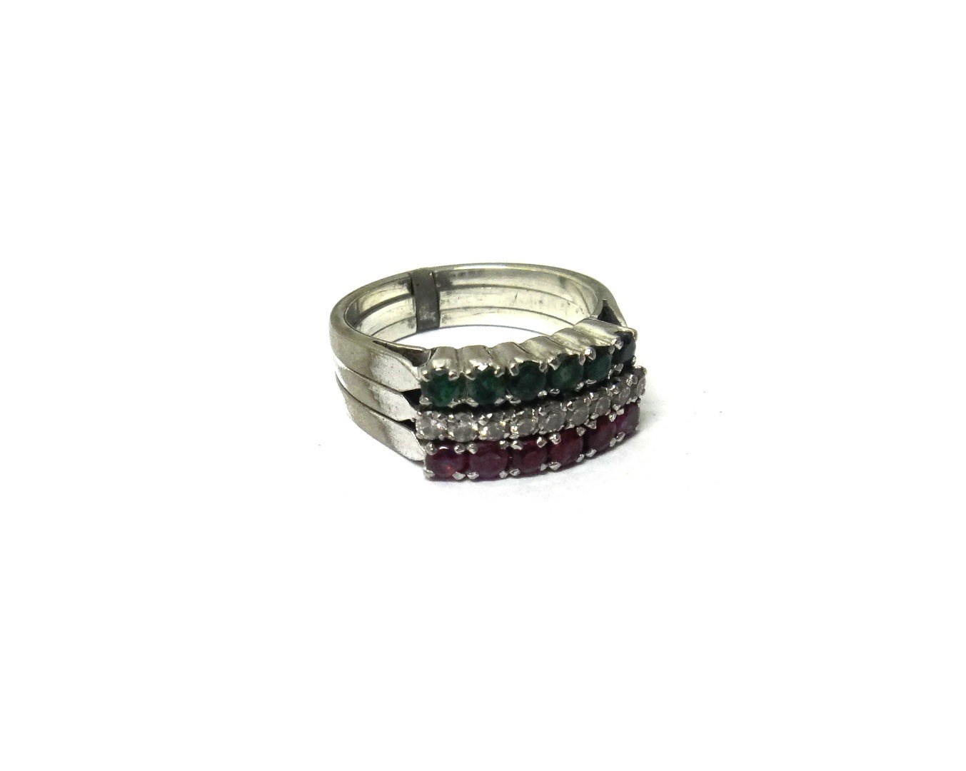 Appraisal: A diamond emerald and ruby set ring in a triple