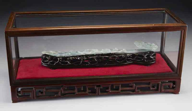 Appraisal: Chinese Qing carved jadeite ruyi scepter finely carved in Lingzhi