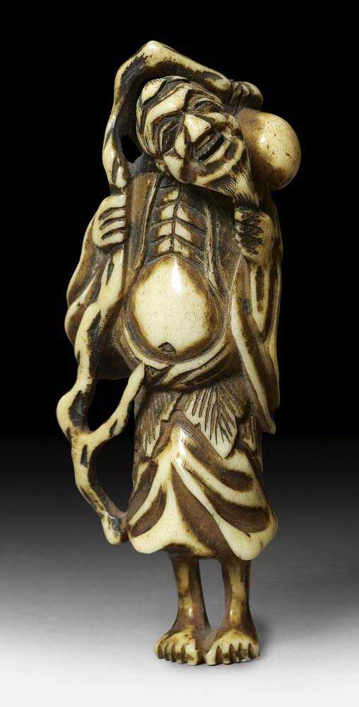 Appraisal: DEER HORN NETSUKE OF A SENNIN Japan early th century