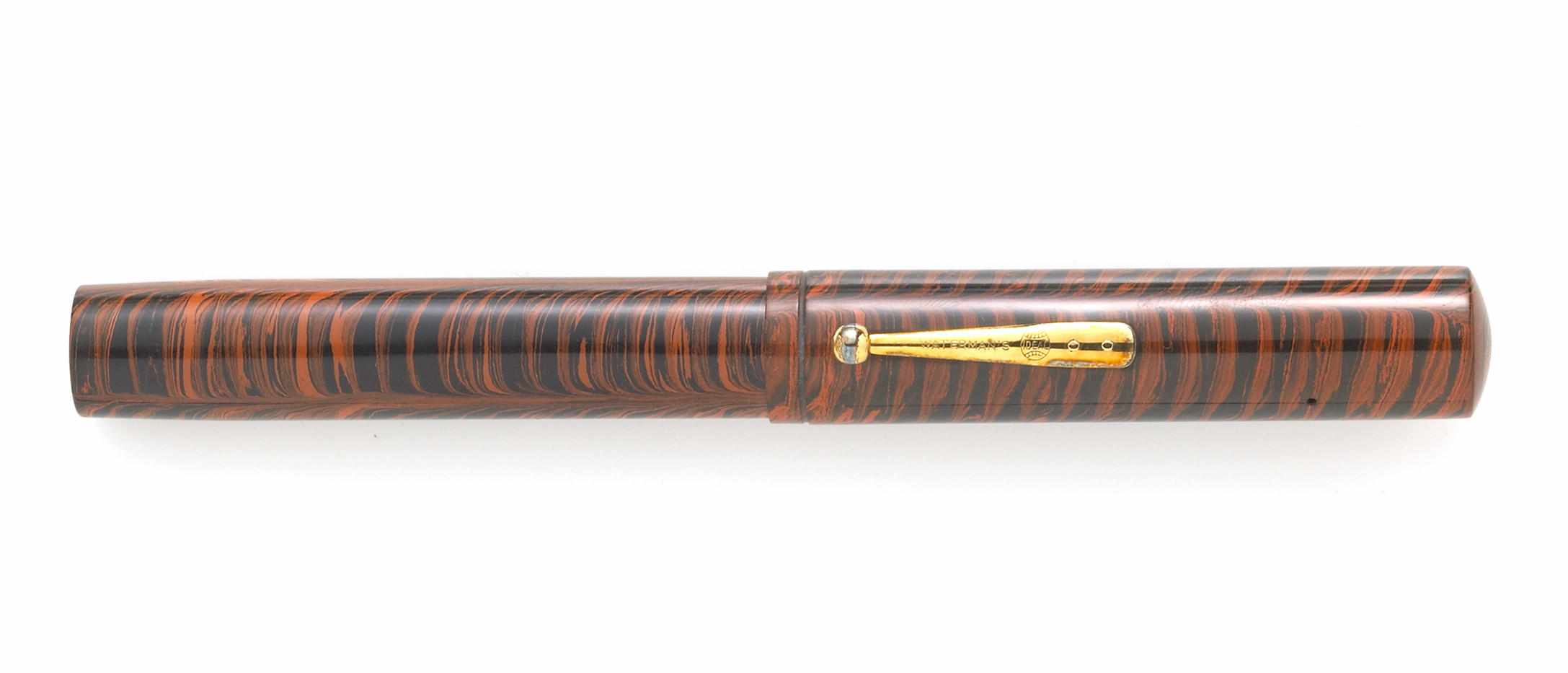 Appraisal: WATERMANS Red Ripple Fountain Pen Ca red mottled hard rubber