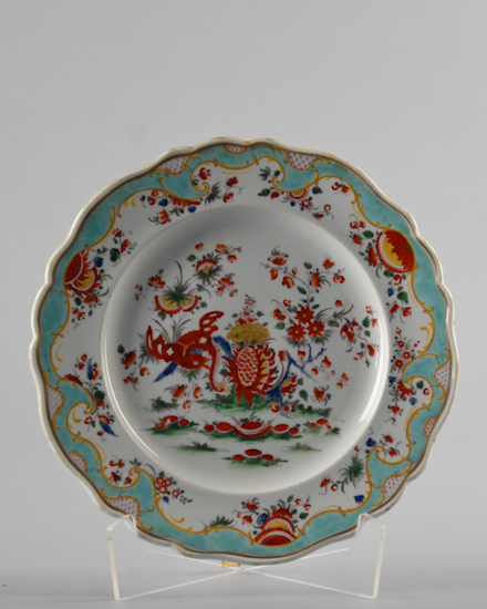 Appraisal: A Worcester Chamberlain Plate with dragon and flower motif scalloped