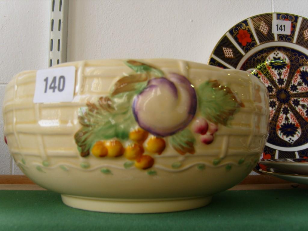 Appraisal: A Clarice Cliff bowl with lattice moulding and relief moulded