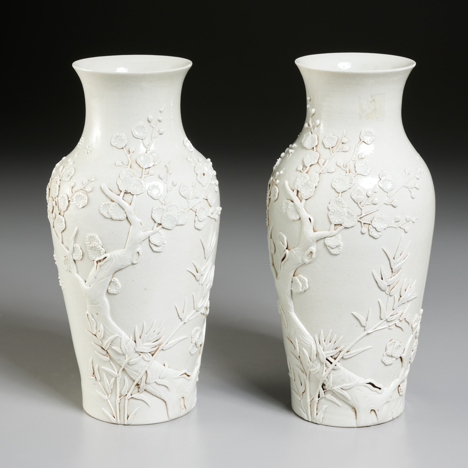 Appraisal: FINE PAIR CHINESE BLANC DE CHINE RELIEF VASES Qing Dynasty