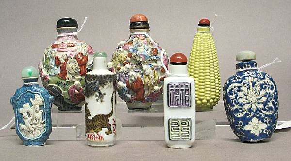 Appraisal: Seven porcelain snuff bottles The first with polychrome enameled tiger