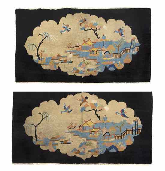 Appraisal: A Pair of Chinese Wool Rugs each decorated with a