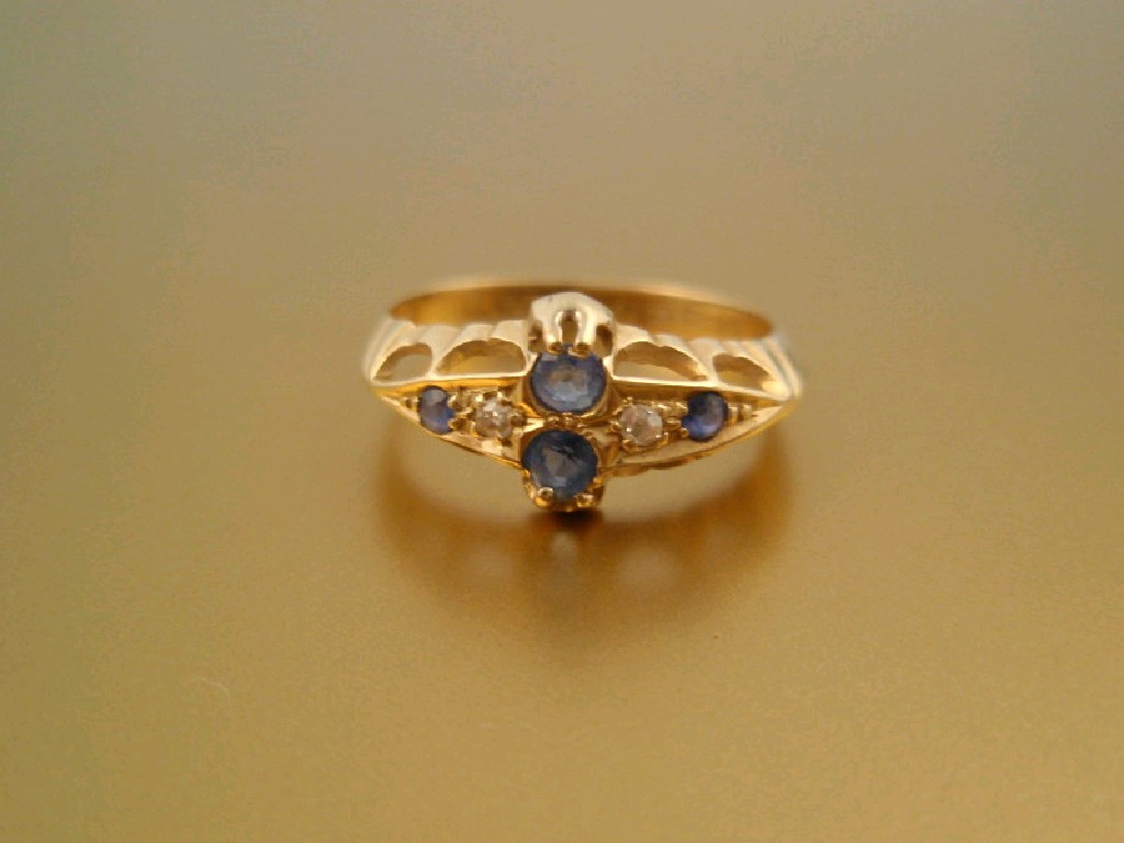 Appraisal: An ct diamond and pale blue sapphire boat shape cluster