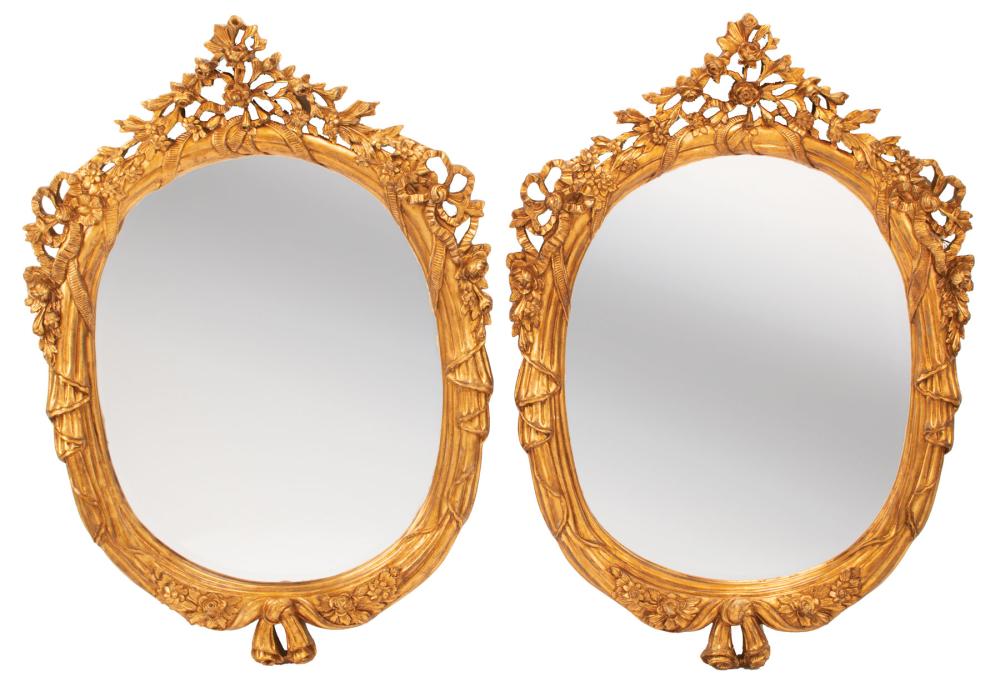 Appraisal: Pair of Louis XV-Style Carved Giltwood Oval Mirrors pierced foliate