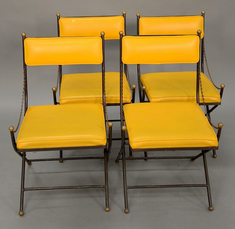 Appraisal: Four Campaign Wrought Iron chairs from 's Four Campaign Wrought