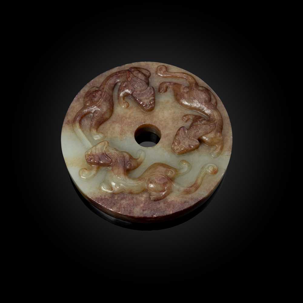 Appraisal: PALE CELADON JADE WITH RUSSET SKIN 'CHI-DRAGON' DISC of circular