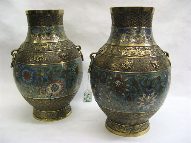 Appraisal: PAIR CHINESE CHAMPLEVE ENAMELED VASES brass accented with ring handles