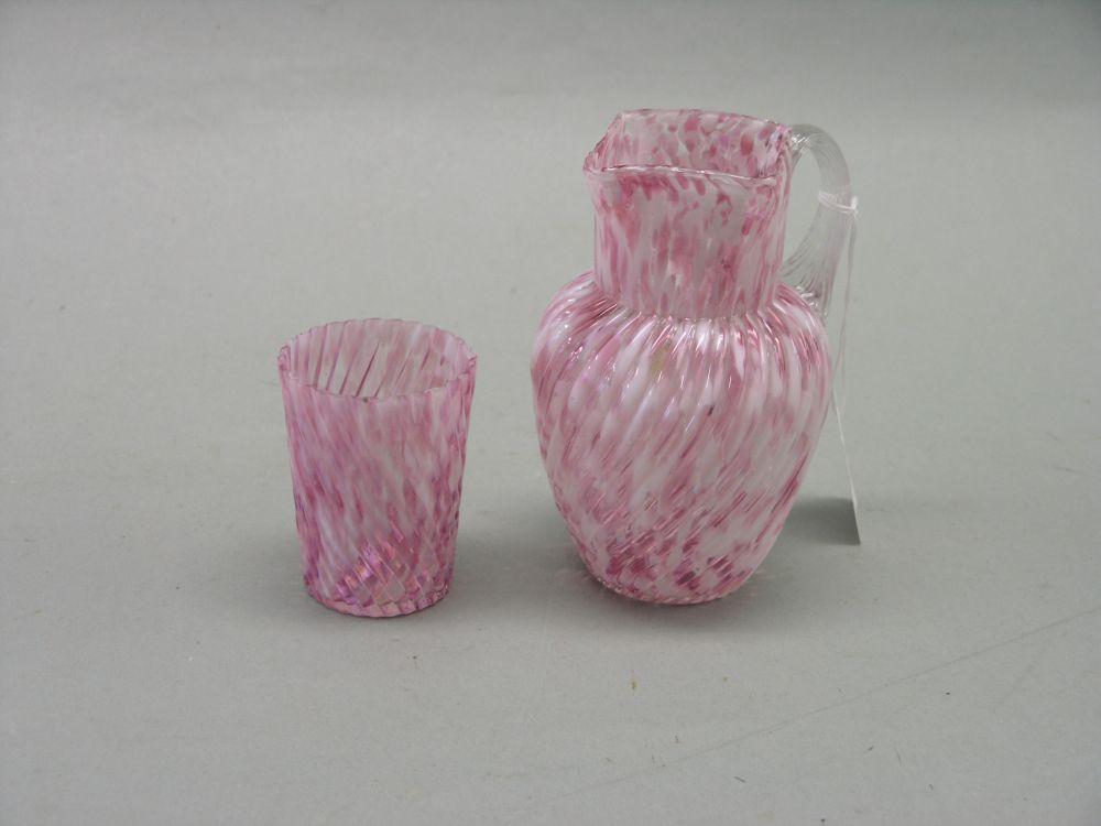 Appraisal: A Victorian coloured glass jug and matching tumbler ruby and