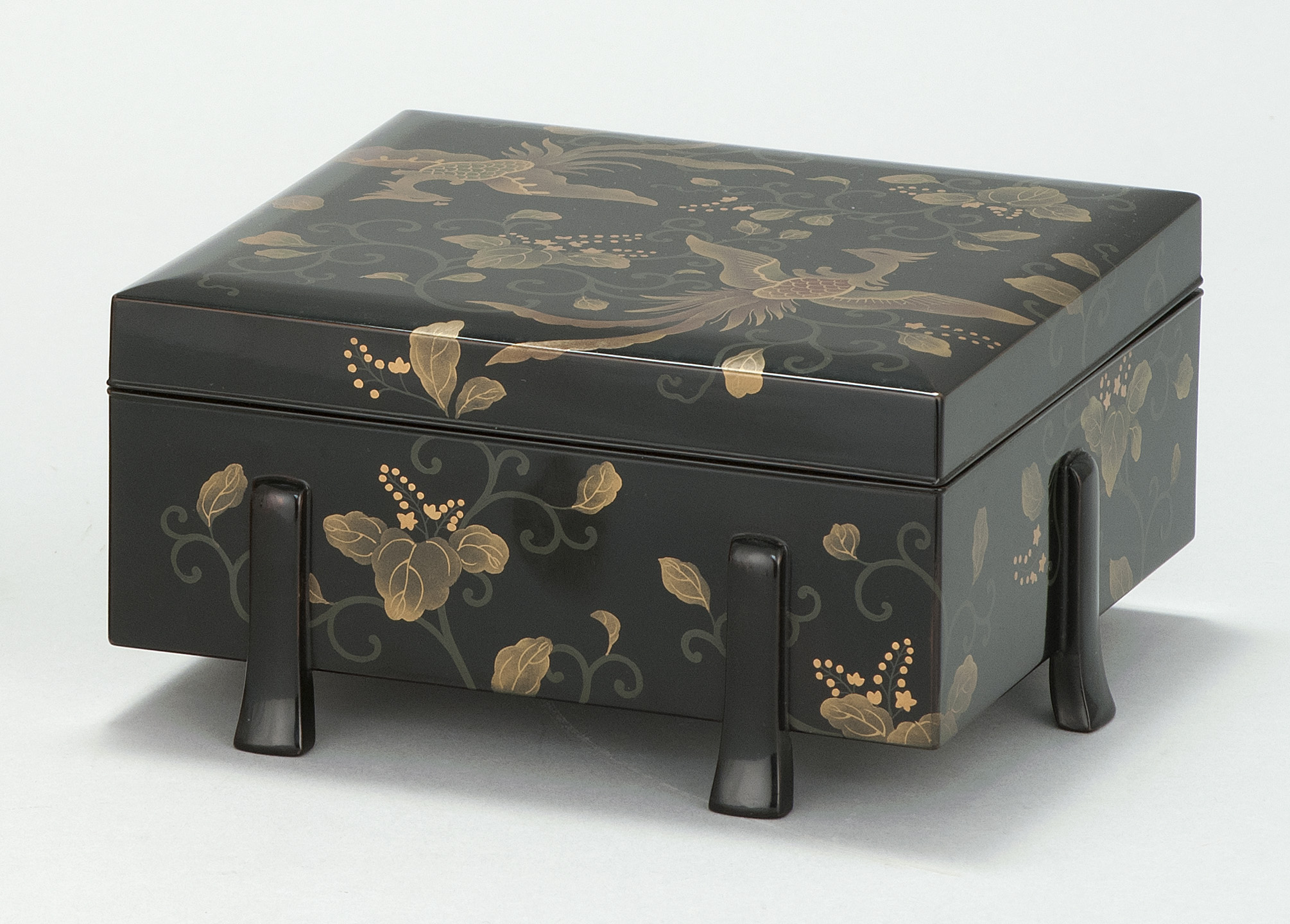 Appraisal: BLACK AND GOLD LACQUER BOX Meiji PeriodTwo gilt phoenixes among