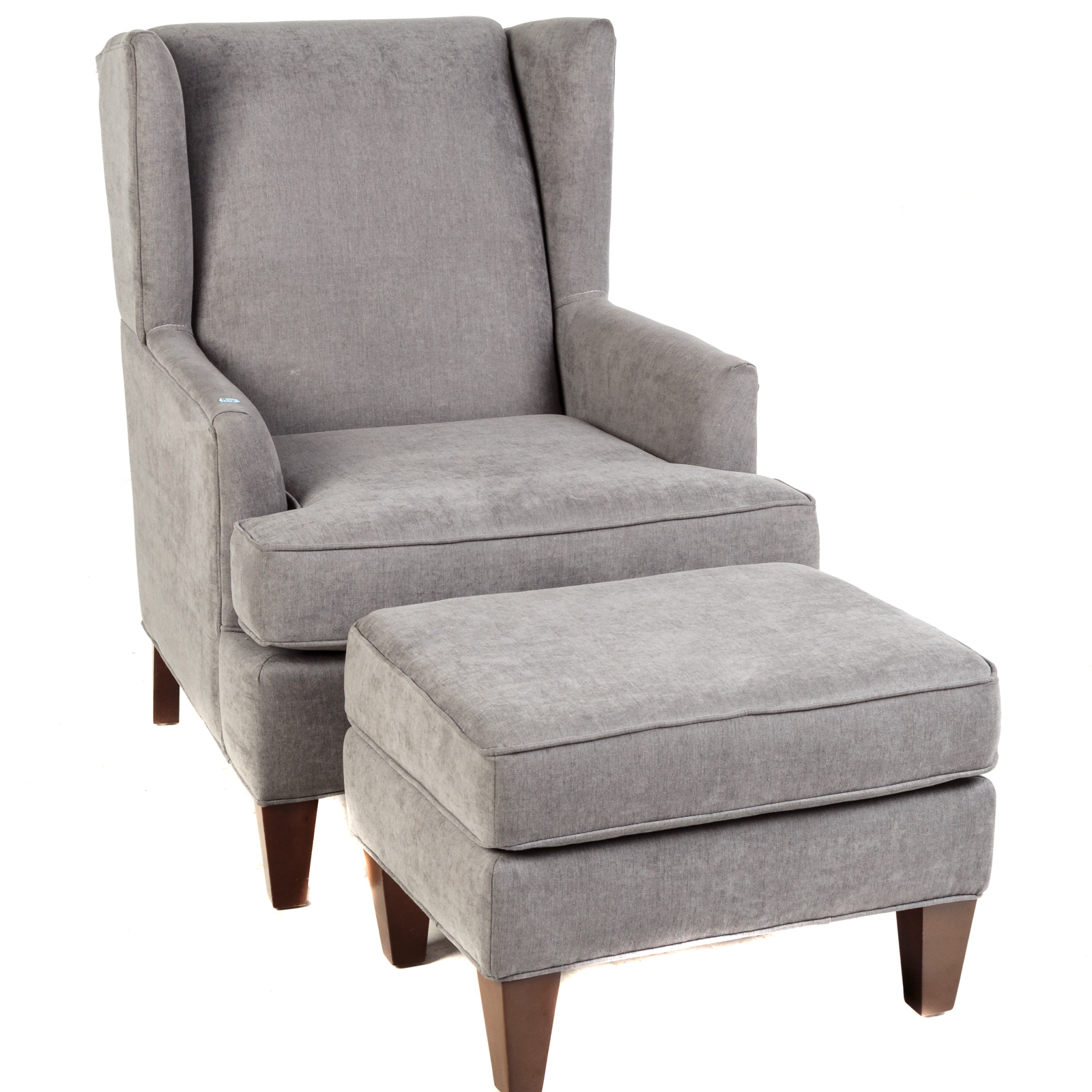 Appraisal: CONTEMPORARY UPHOLSTERED WING CHAIR OTTOMAN With custom upholstery Chair in