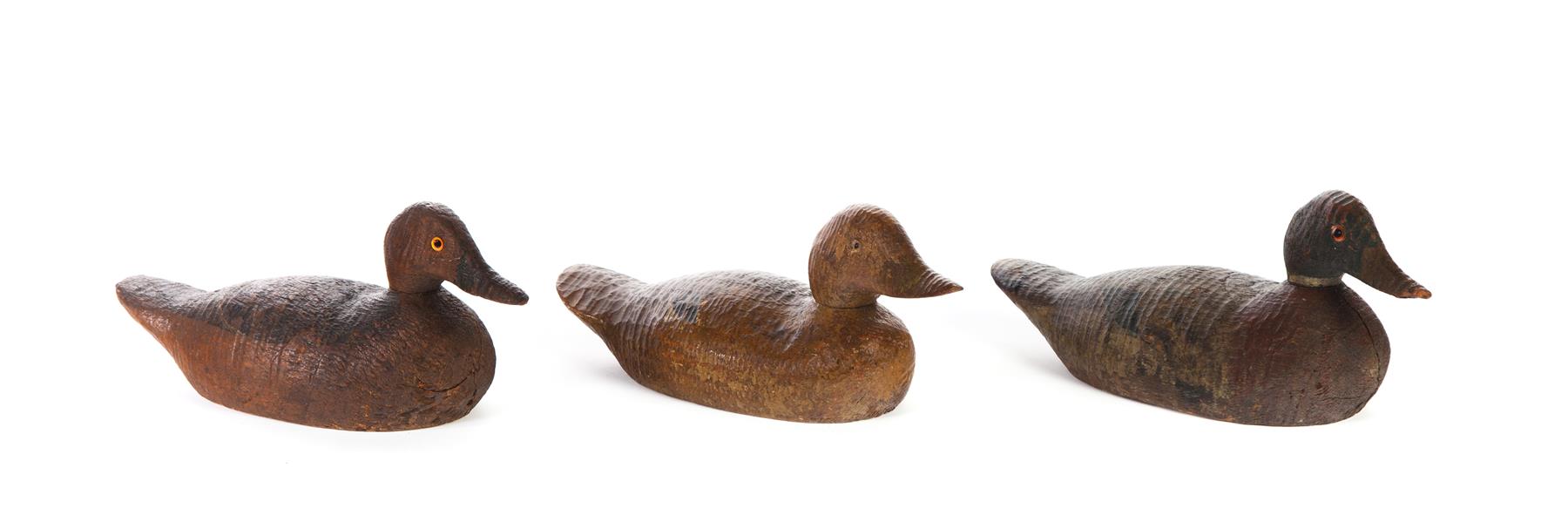 Appraisal: THREE PRIMITIVE DUCK DECOYS WITH PAINT DECORATION American nd half-