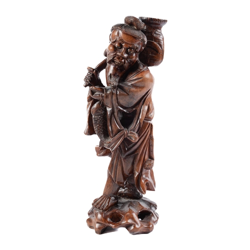 Appraisal: A Chinese rootwood figure of a fisherman th early th