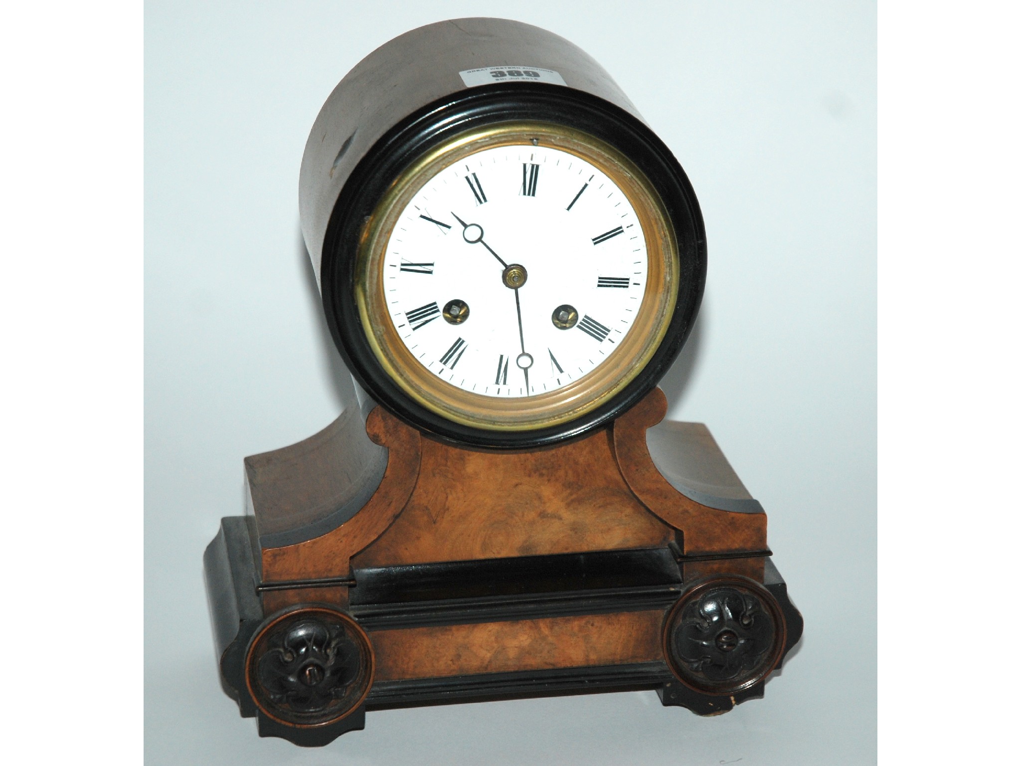 Appraisal: A Victorian mantle clock with white dial and Roman numerals