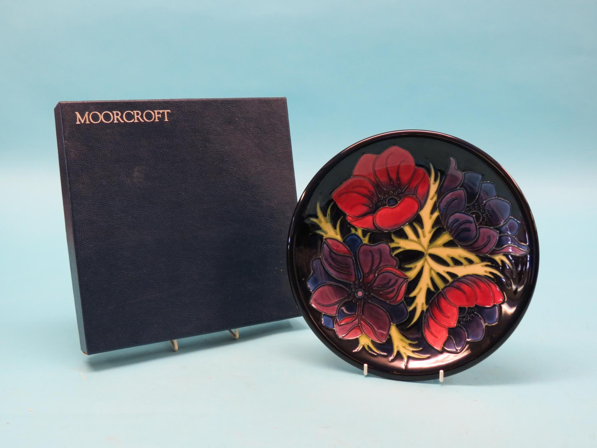 Appraisal: A modern Moorcroft plate Anemone against a deep blue ground