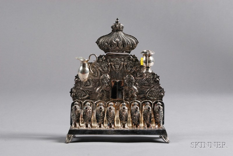 Appraisal: Continental Silver Menorah th century backplate topped with crown and