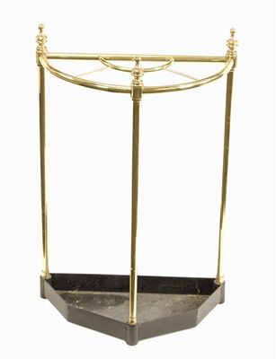 Appraisal: A turned brass demi-lune stickstand with five divisions modern in