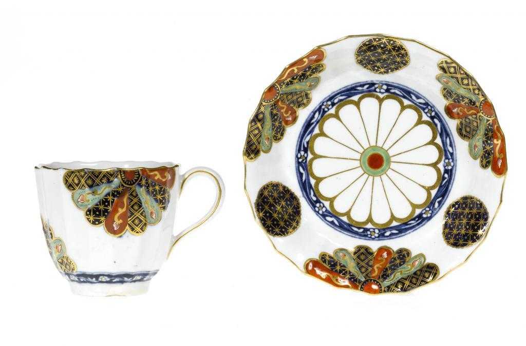 Appraisal: A DERBY FLUTED COFFEE CUP AND SAUCER enamelled and richly