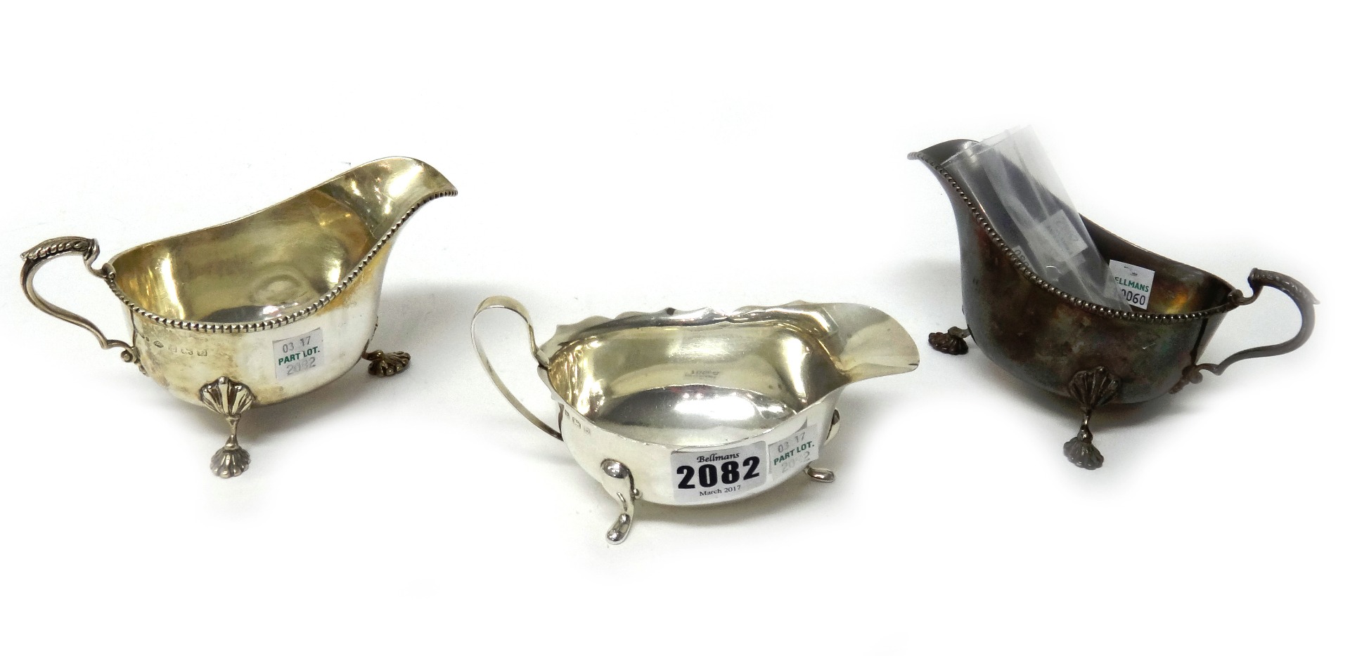 Appraisal: A silver sauceboat having a shaped rim raised on three