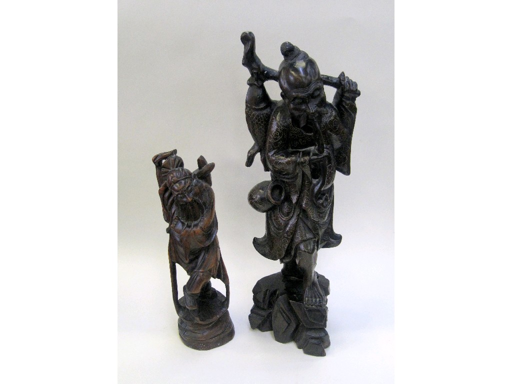 Appraisal: Two carved wooden figures of sages - one with silver