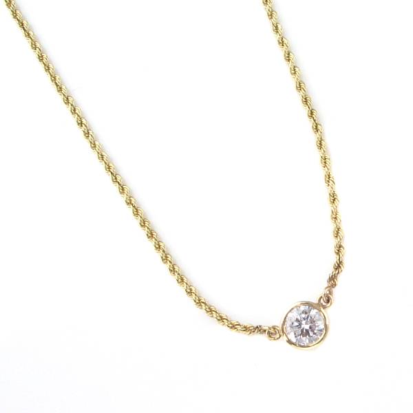 Appraisal: A diamond solitaire pendant with gold chain featuring one bezel