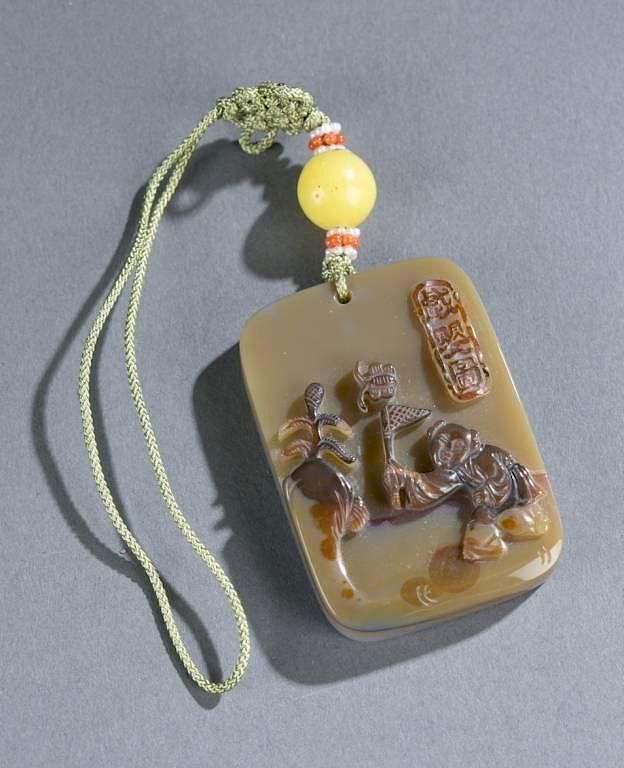 Appraisal: Chinese carved agate toggle th C A Chinese carved agate