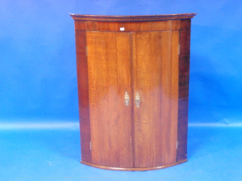 Appraisal: A George III oak and mahogany cylinder fronted hanging corner