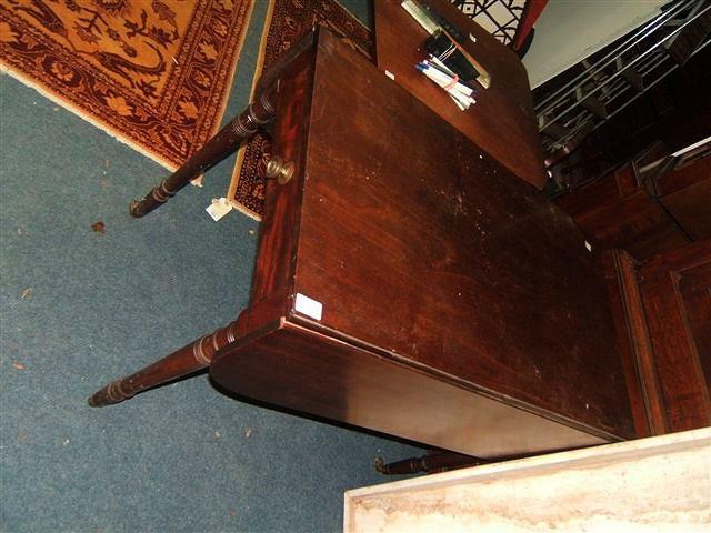 Appraisal: A Victorian mahogany Pembroke table with single drawer to one