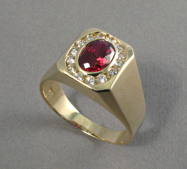 Appraisal: MAN'S GARNET AND DIAMOND RING k yellow gold centering an