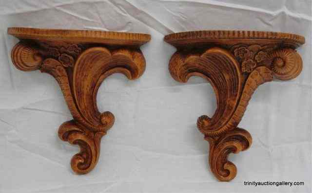 Appraisal: 's Pair Syroco Wood Wall ShelvesProduced and date by Multi