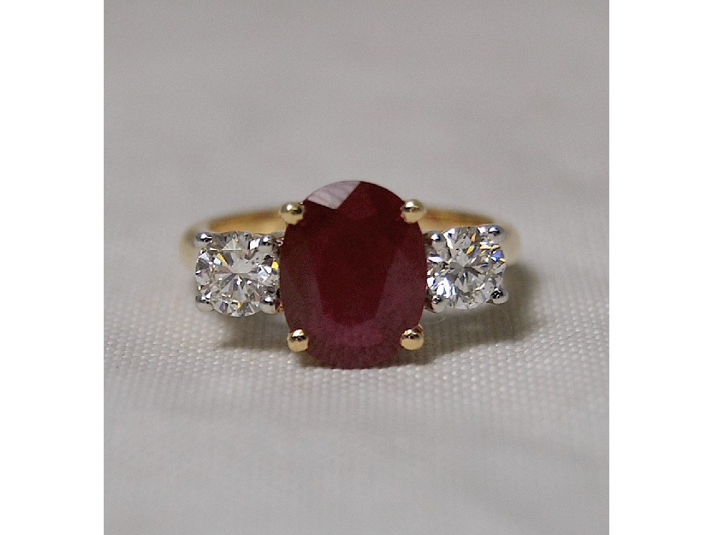 Appraisal: Diamond and ruby three stone ring ruby cts diamond yellow